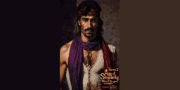 A pixelated Version of the portrait of Zoltan, made of tiny squares.